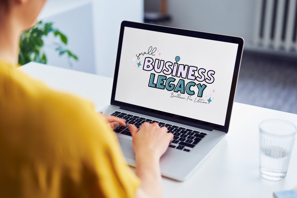 A business owner at a laptop showing the Small Business Legacy Balloon Pro Edition logo